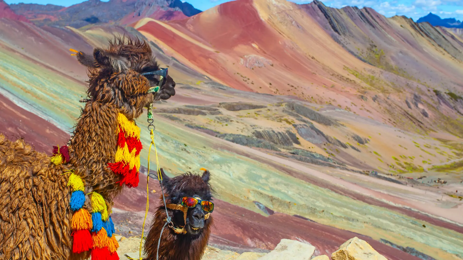 Guide explaining Rainbow Mountain to a group of tourists
