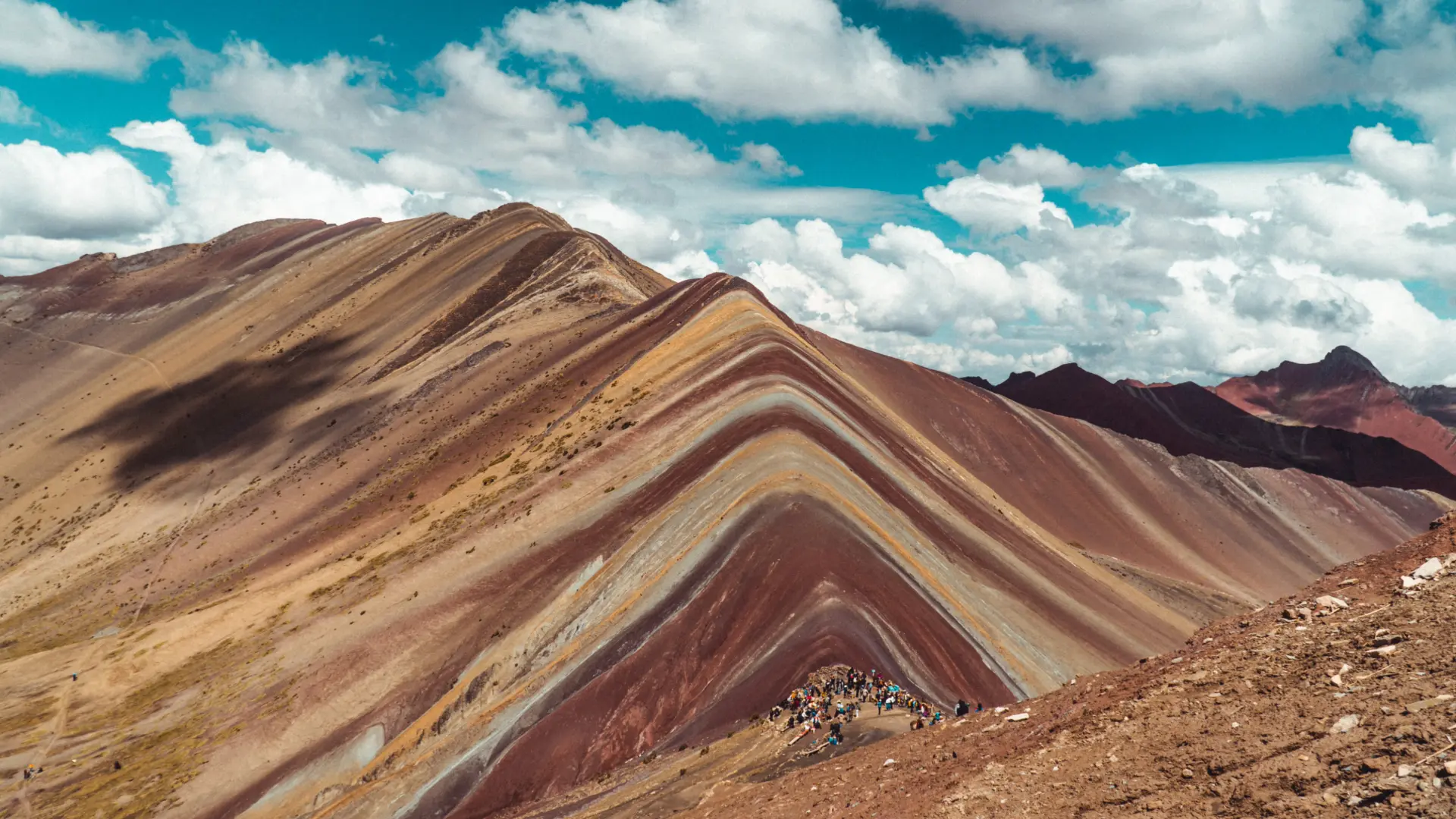 Group of hikers enjoying Seven Colors Tours at Rainbow Mountain in Peru