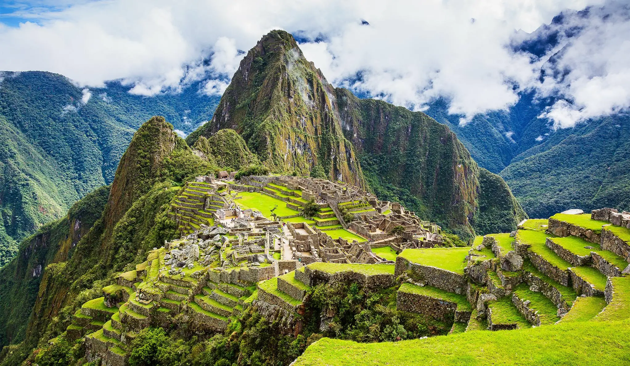 Tourists with guides in Machu Picchu and Rainbow Mountain