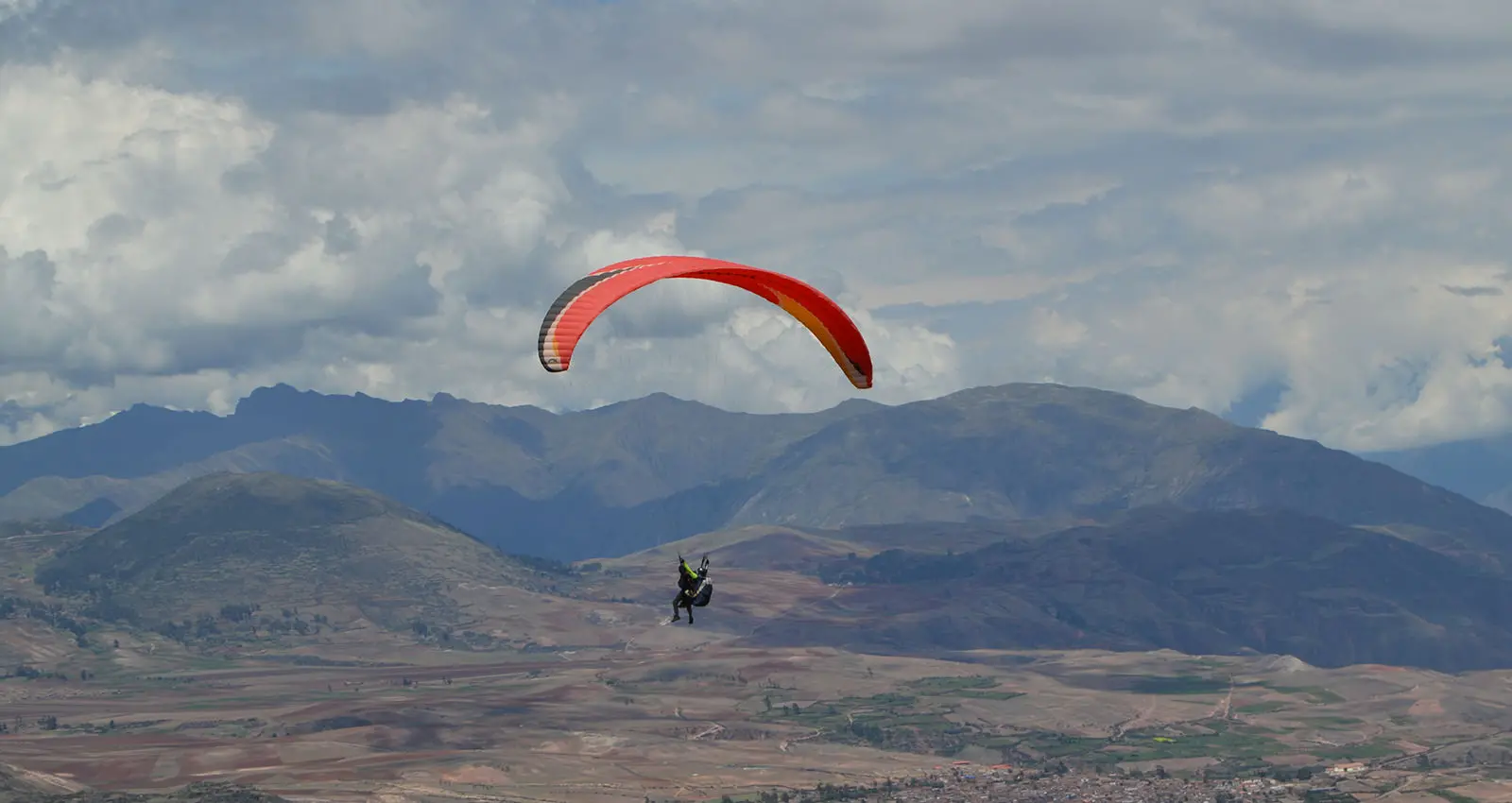paragliding sacred valley peru with andes mountains